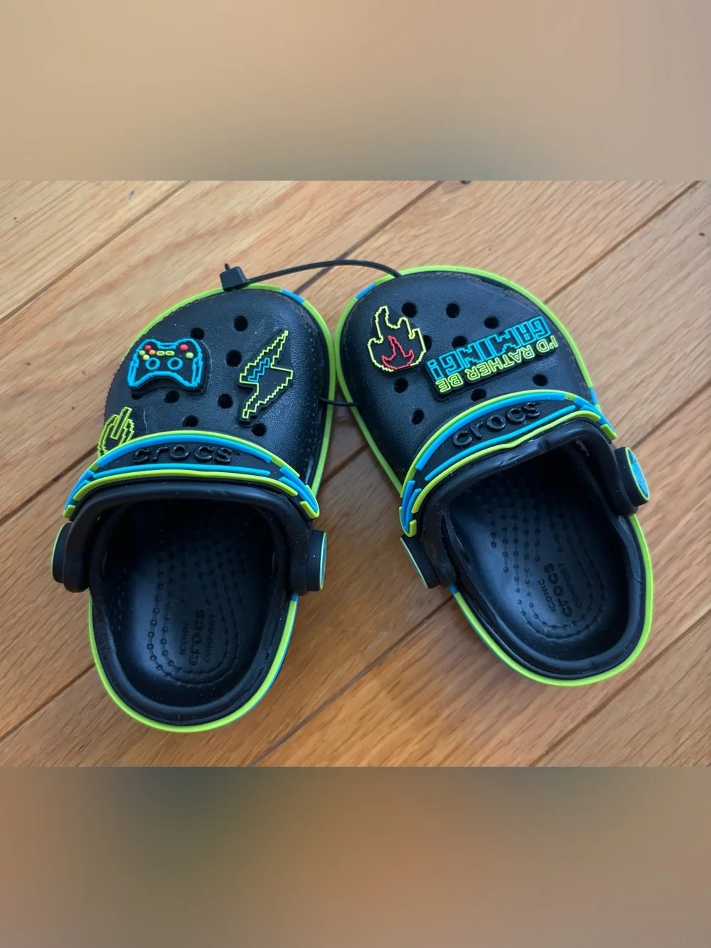 CROCS Toddler’s Black Clogs with Neon Green and Blue Trim and Gamer Jibbitz
